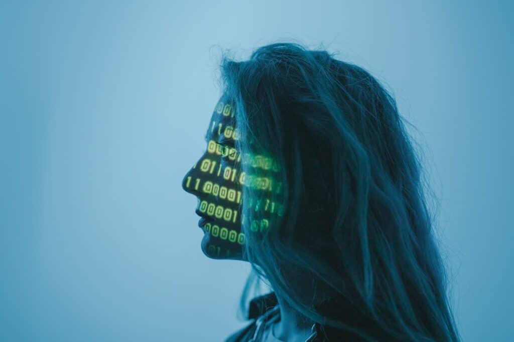 cybersecurity code projected onto woman's face